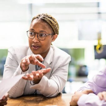 Businesswoman leading office discussion